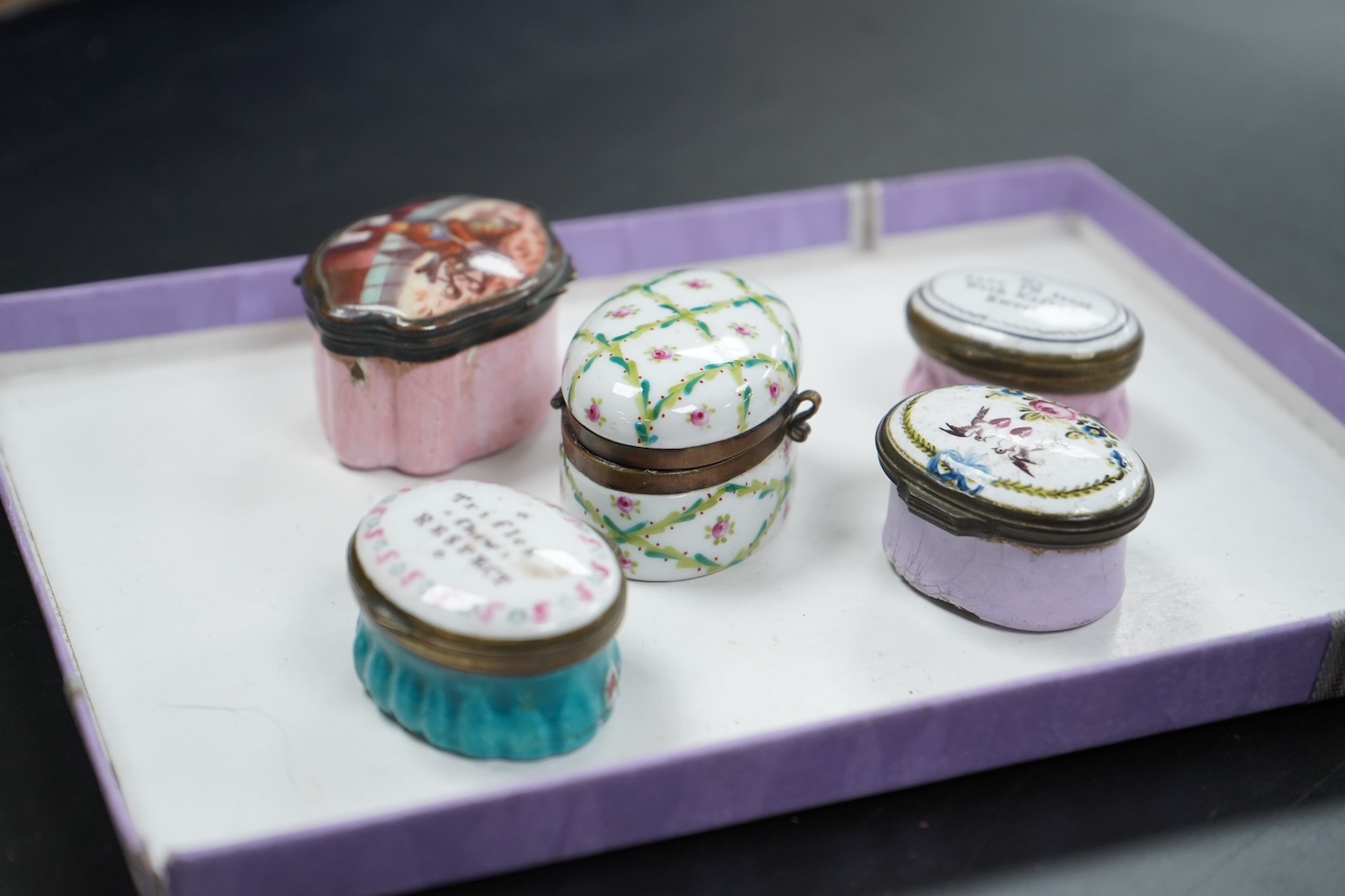 Five late 18th and 19th century enamel South Staffordshire patch boxes, largest 5.5cm wide